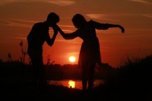 love-couple-kissing-on-hand-at-sunset-couple 3